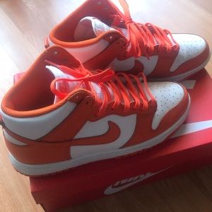 Men’s 9-1/2 orange and white Jordans